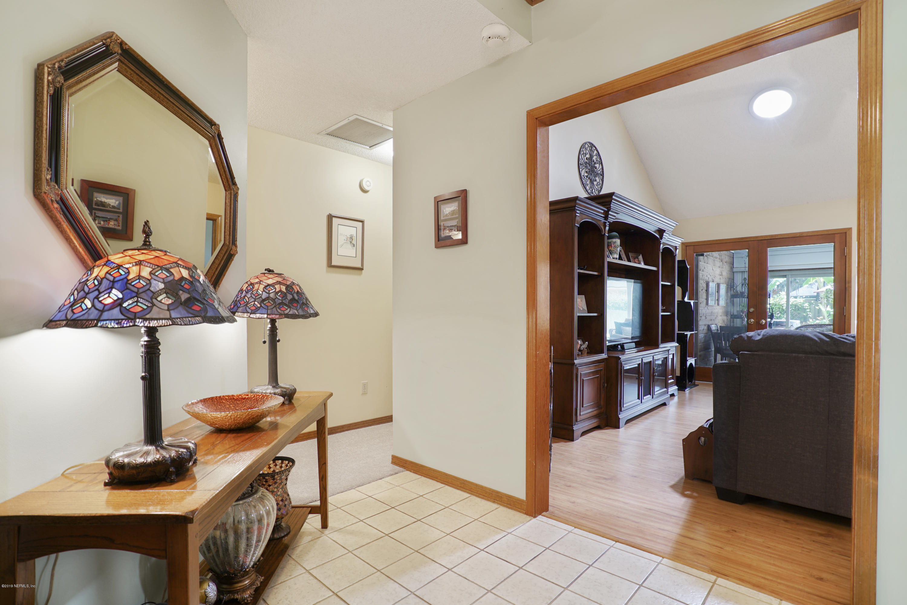 3165 Nautilus Road Middleburg, FL 32068 - Photo 6 of 35 a living room with furniture and wooden floor