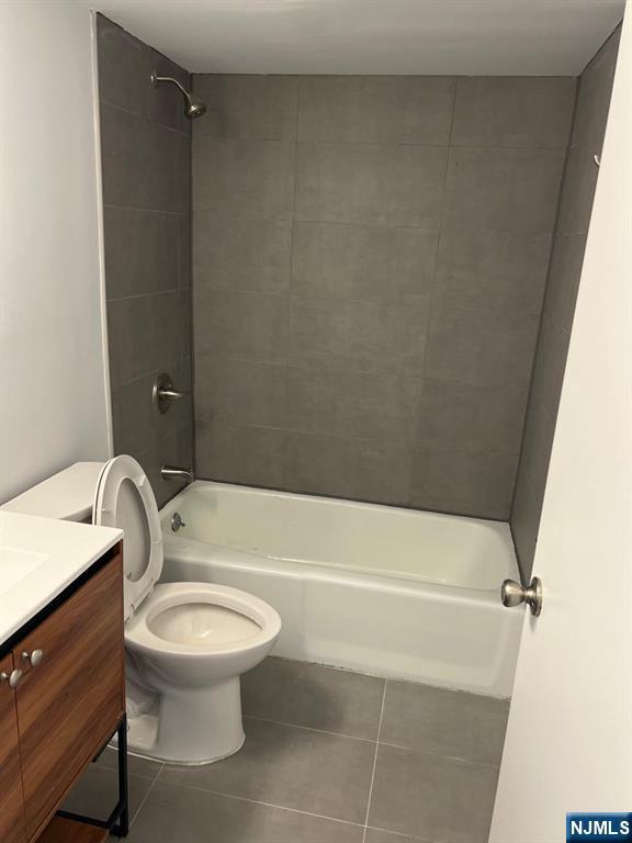 47 Polifly Road, Unit 1A Hackensack, NJ 07601 - Photo 12 of 12 a bathroom with a toilet a sink and bathtub