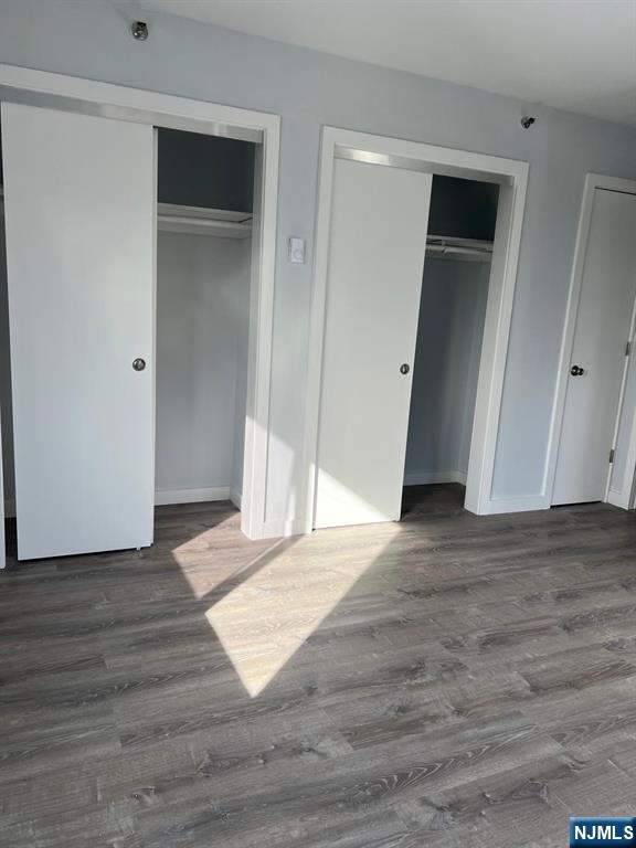 47 Polifly Road, Unit 1A Hackensack, NJ 07601 - Photo 14 of 19 a view of an empty room with wooden floor and closet