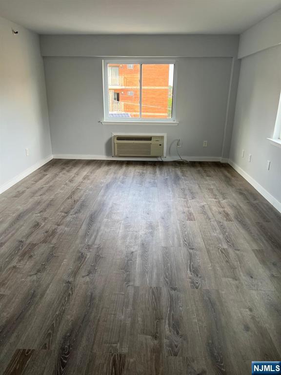 47 Polifly Road, Unit 1A Hackensack, NJ 07601 - Photo 2 of 12 wooden floor in an empty room with a window