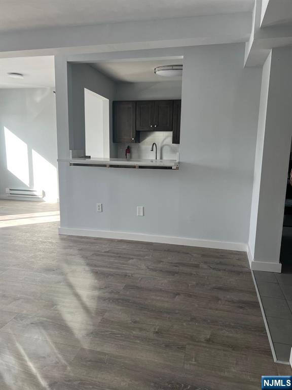 47 Polifly Road, Unit 1A Hackensack, NJ 07601 - Photo 2 of 19 a view of a kitchen with furniture and wooden floor