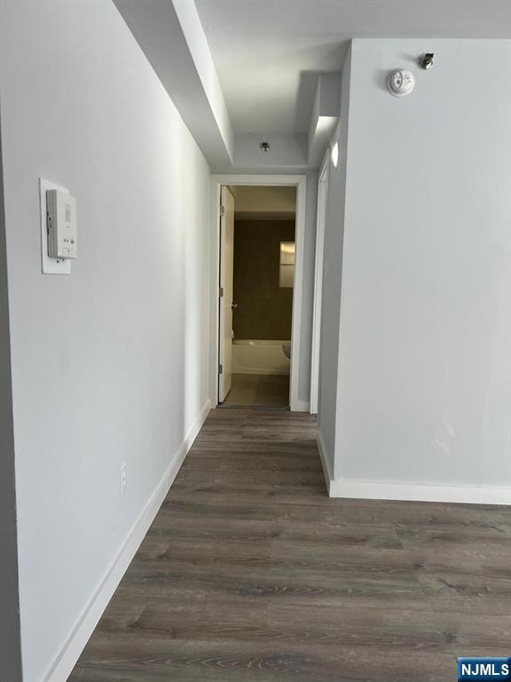47 Polifly Road, Unit 1A Hackensack, NJ 07601 - Photo 6 of 19 a view of a hallway with wooden floor