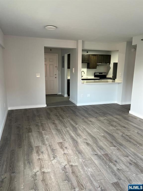47 Polifly Road, Unit 1A Hackensack, NJ 07601 - Photo 8 of 12 a view of a kitchen with a sink and a microwave