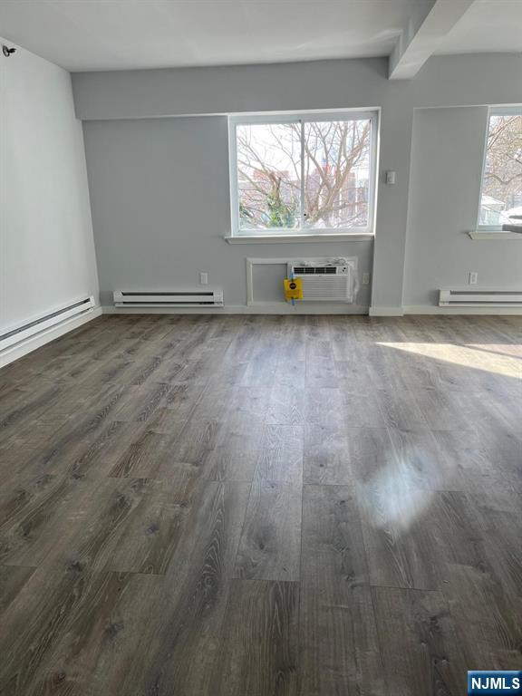 47 Polifly Road, Unit 1A Hackensack, NJ 07601 - Photo 8 of 19 an empty room with large windows