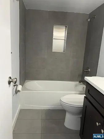 a bathroom with a sink a toilet and a bathtub