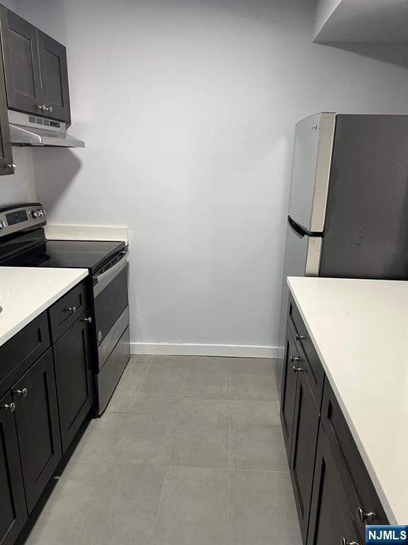 47 Polifly Road, Unit 1A Hackensack, NJ 07601 - Photo 10 of 12 a kitchen with a sink and a stove