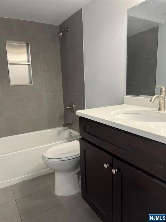 47 Polifly Road, Unit 1A Hackensack, NJ 07601 - Photo 10 of 19 a bathroom with a sink a toilet and shower