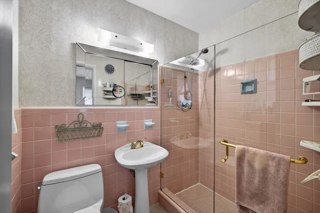 a view of a house with swimming pool and sitting area