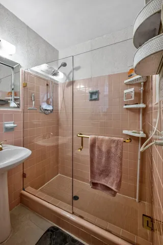 a view of a swimming pool with a patio and city view