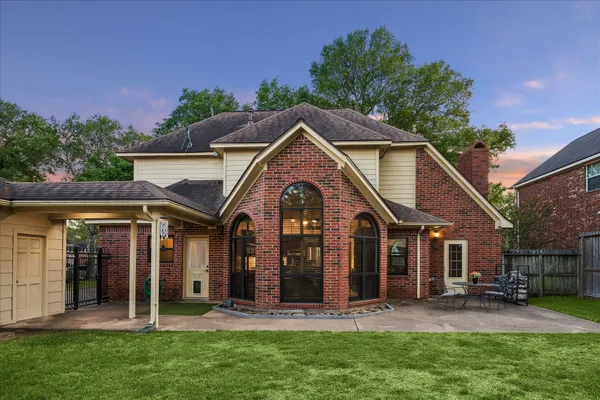 front view of a house with a garden