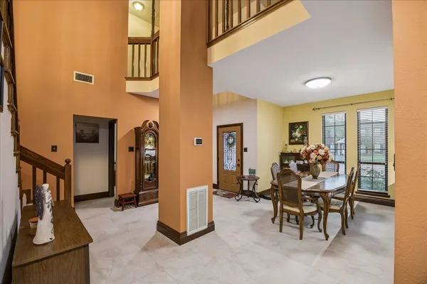 a view of a livingroom with furniture and front door