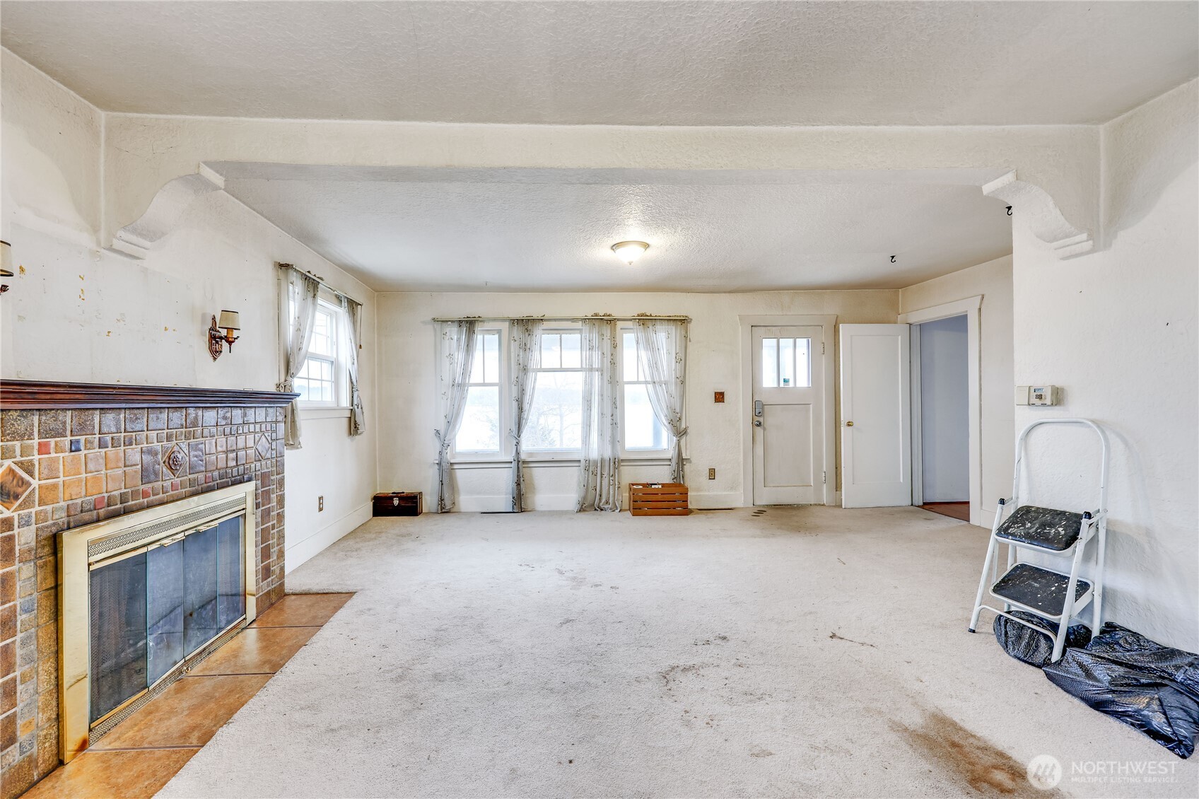 514 Shore Drive Bremerton, WA 98310 - Photo 11 of 40 a view of a livingroom with a fireplace and window