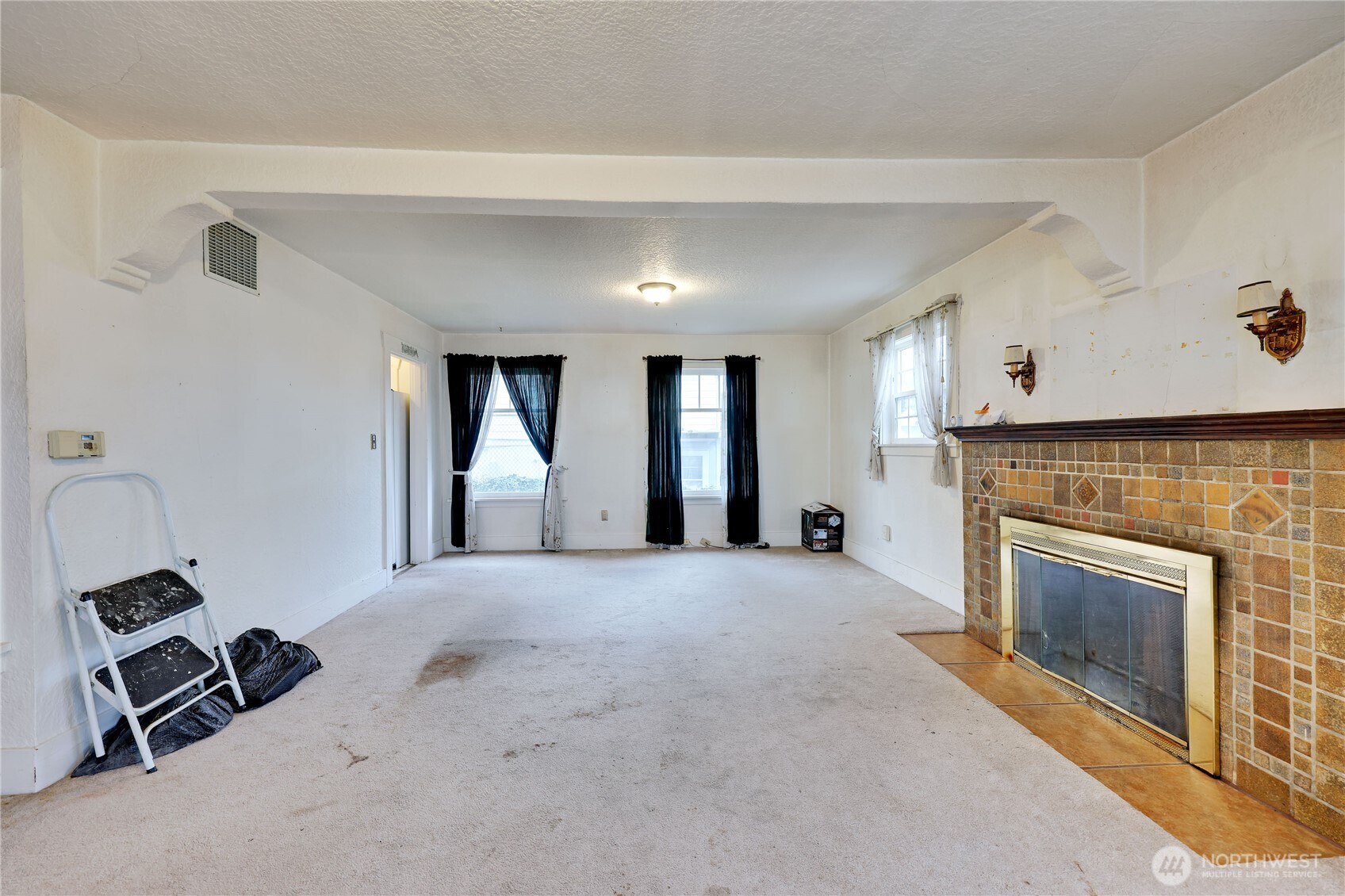 514 Shore Drive Bremerton, WA 98310 - Photo 13 of 40 a view of a livingroom with a fireplace and window