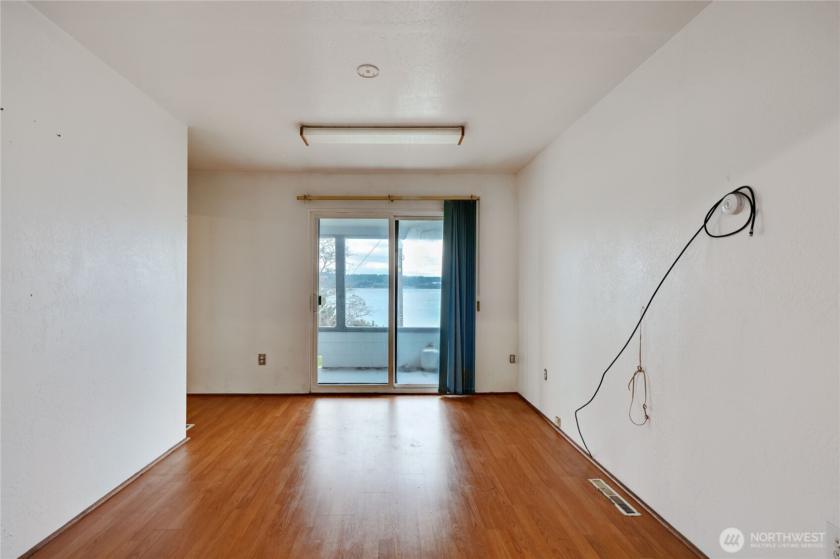 514 Shore Drive Bremerton, WA 98310 - Photo 18 of 40 a view of room with window and wooden floor