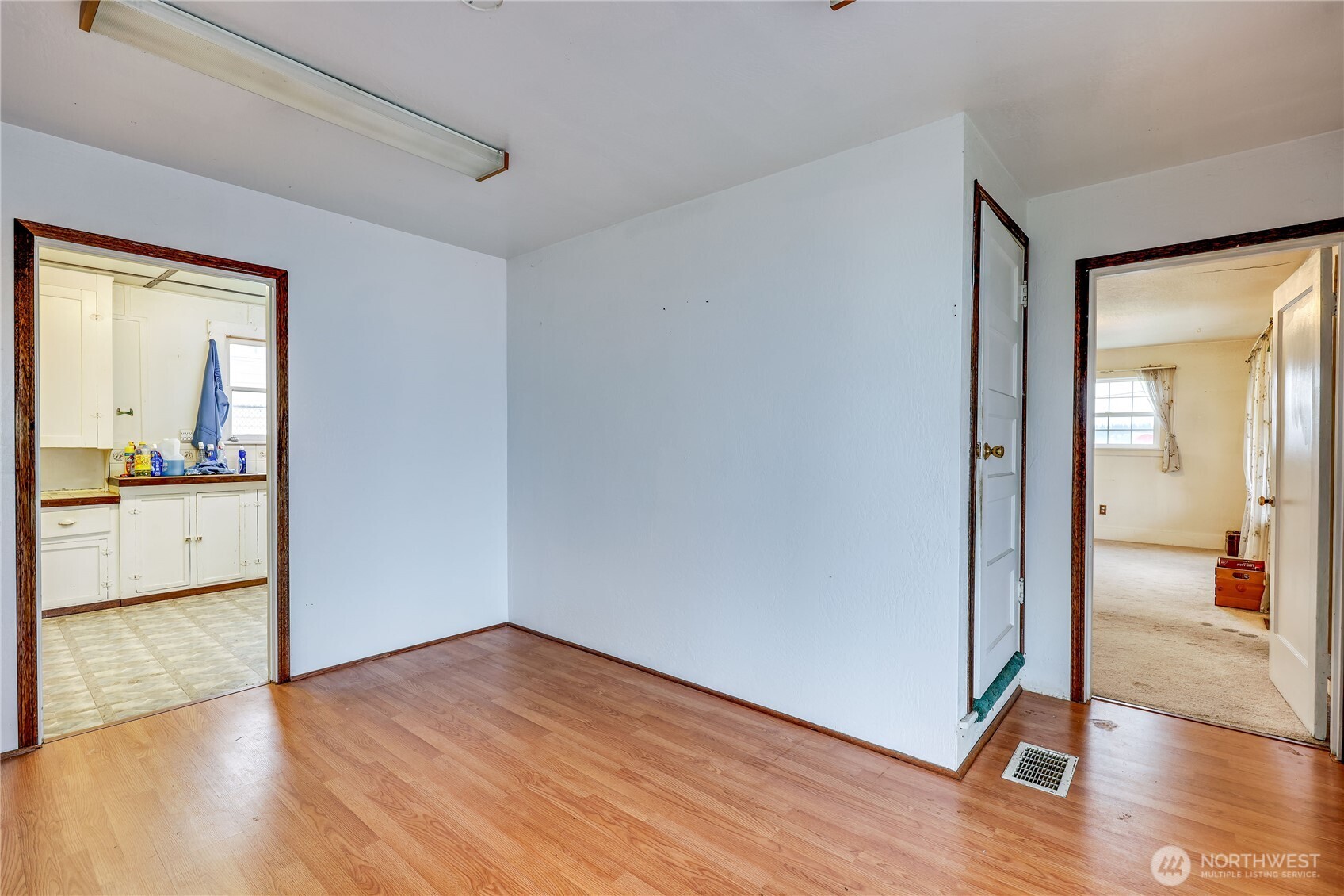 514 Shore Drive Bremerton, WA 98310 - Photo 19 of 40 an empty room with wooden floor and a bathroom