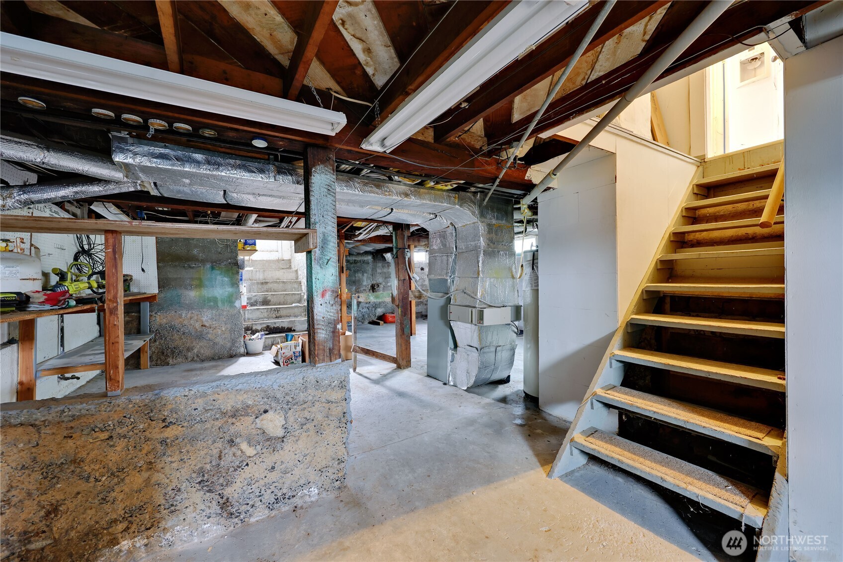 514 Shore Drive Bremerton, WA 98310 - Photo 28 of 40 a view of an empty room with wooden floor and stairs