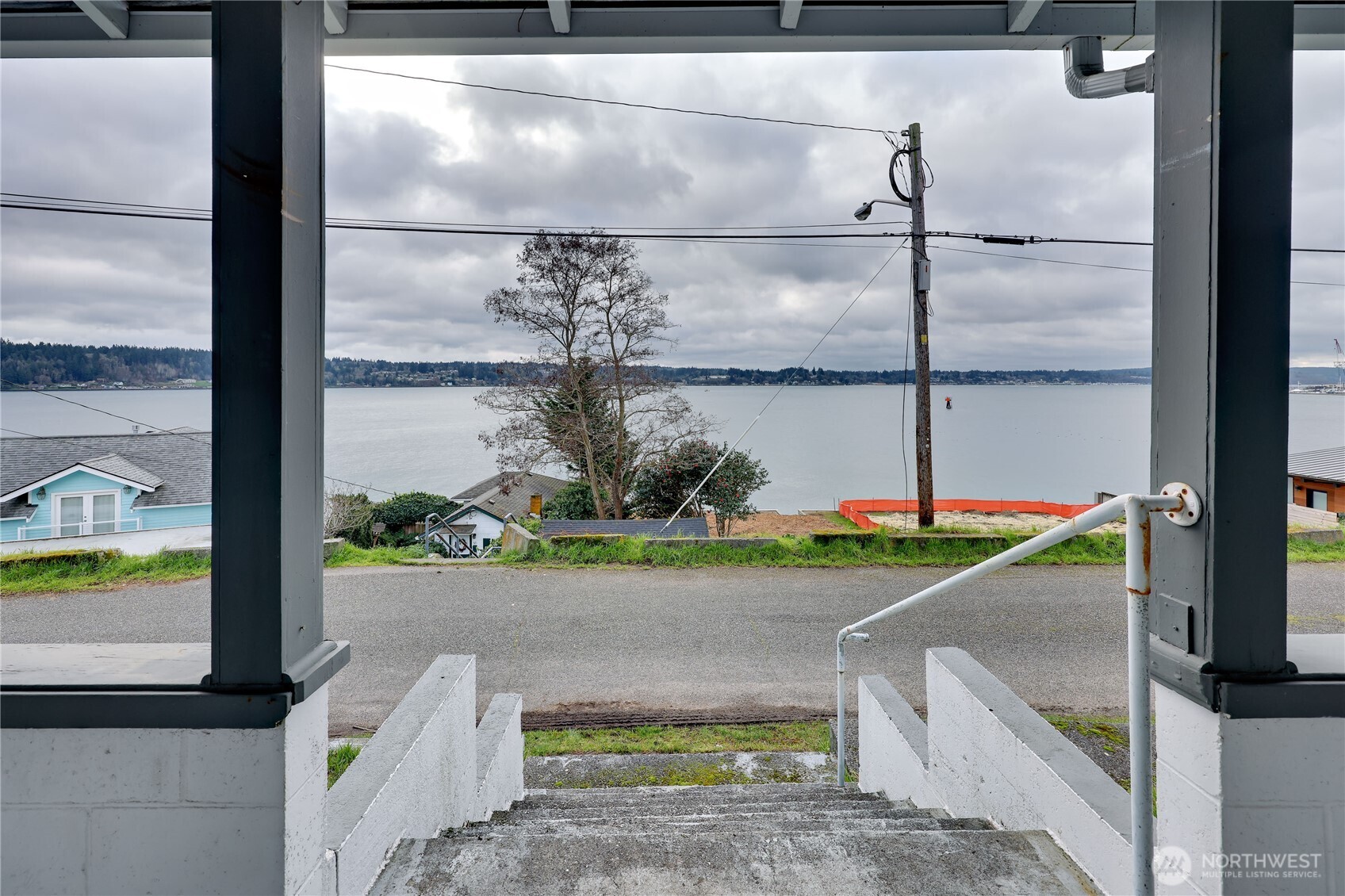 514 Shore Drive Bremerton, WA 98310 - Photo 36 of 40 a front view of a house with a yard and a wooden fence