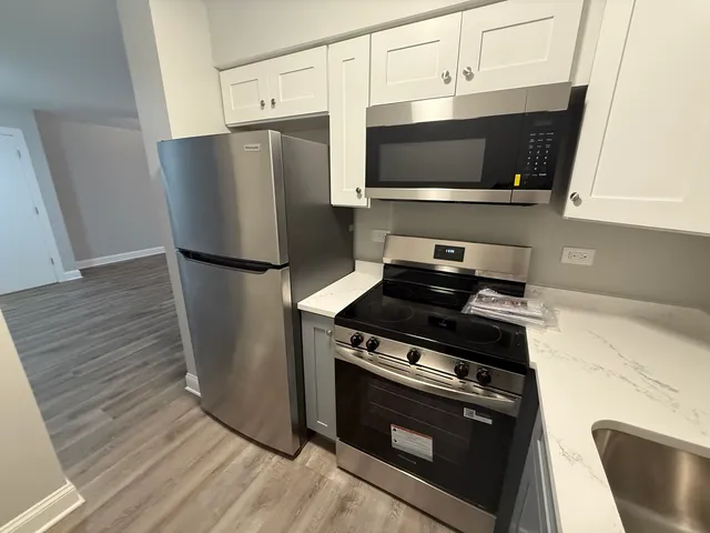 a kitchen with a stove and a microwave