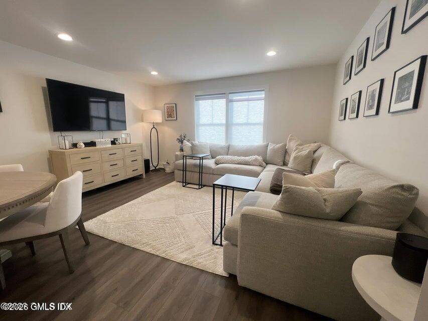 4 Orchard Street, Unit M Cos Cob, CT 06807 - Photo 3 of 19 a living room with furniture and a flat screen tv