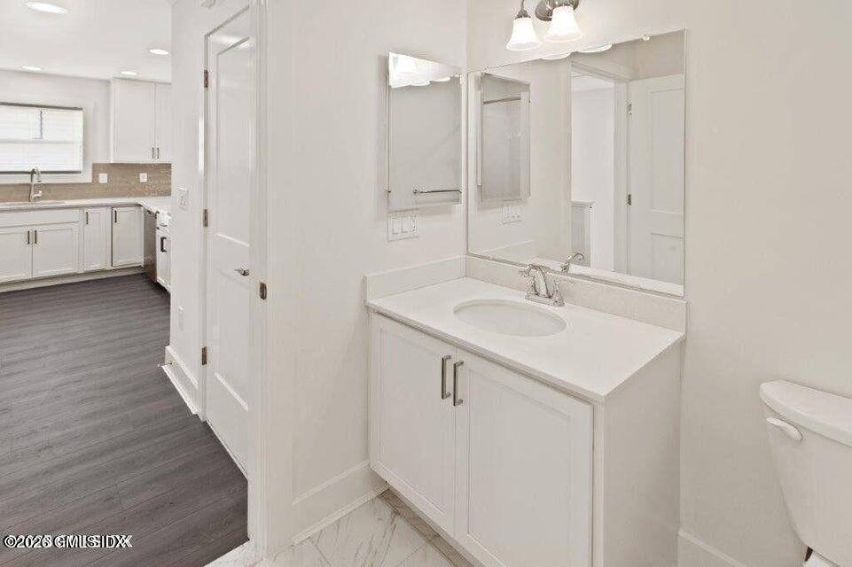 4 Orchard Street, Unit M Cos Cob, CT 06807 - Photo 5 of 19 a bathroom with a sink a toilet and shower
