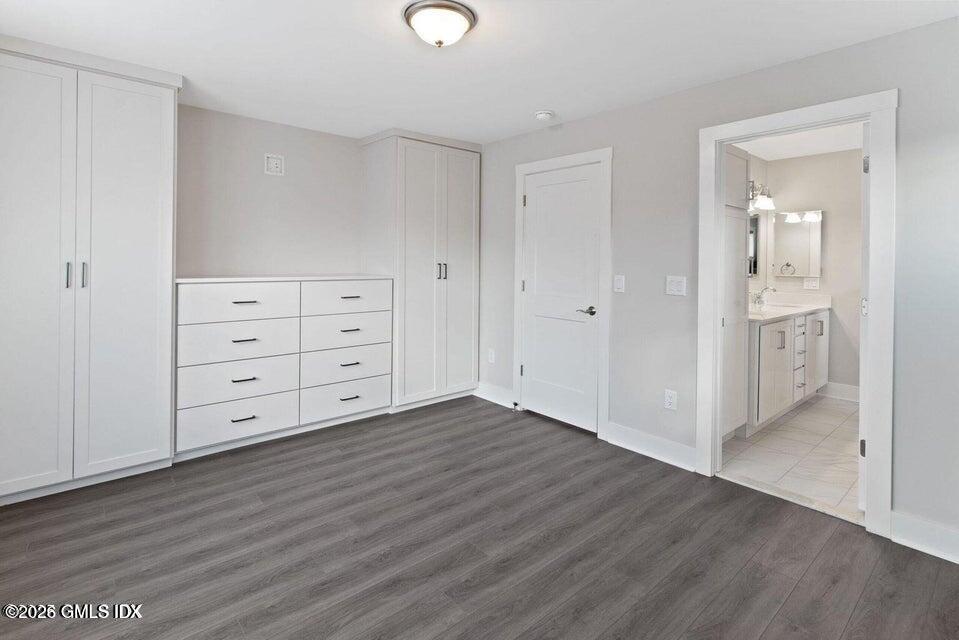 4 Orchard Street, Unit M Cos Cob, CT 06807 - Photo 6 of 19 a view of an empty room with wooden floor