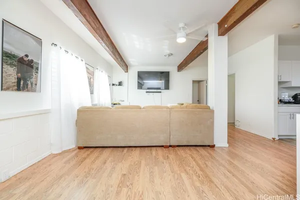 a view of a living room with a wooden floor