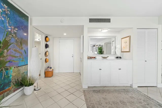 a view of a bathroom with a sink and mirror