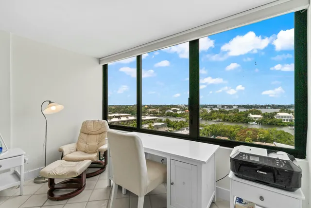 a room with furniture and large windows