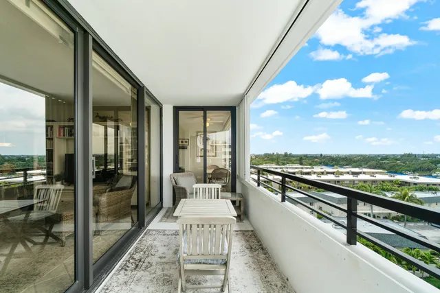a view of a balcony with furniture