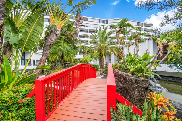 a view of a house with pool and sitting area