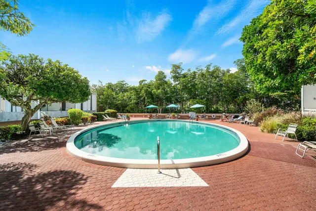 a view of a swimming pool with a patio
