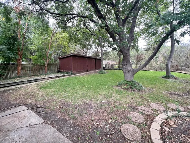 a backyard of a house with lots of green space