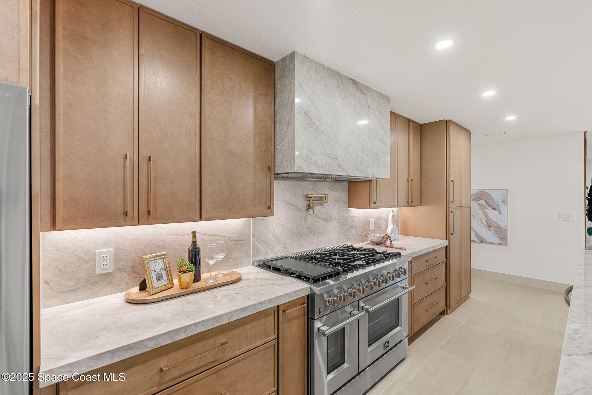 4313 Country Road Melbourne, FL 32934 - Photo 11 of 58 a kitchen with granite countertop cabinets and stove top oven