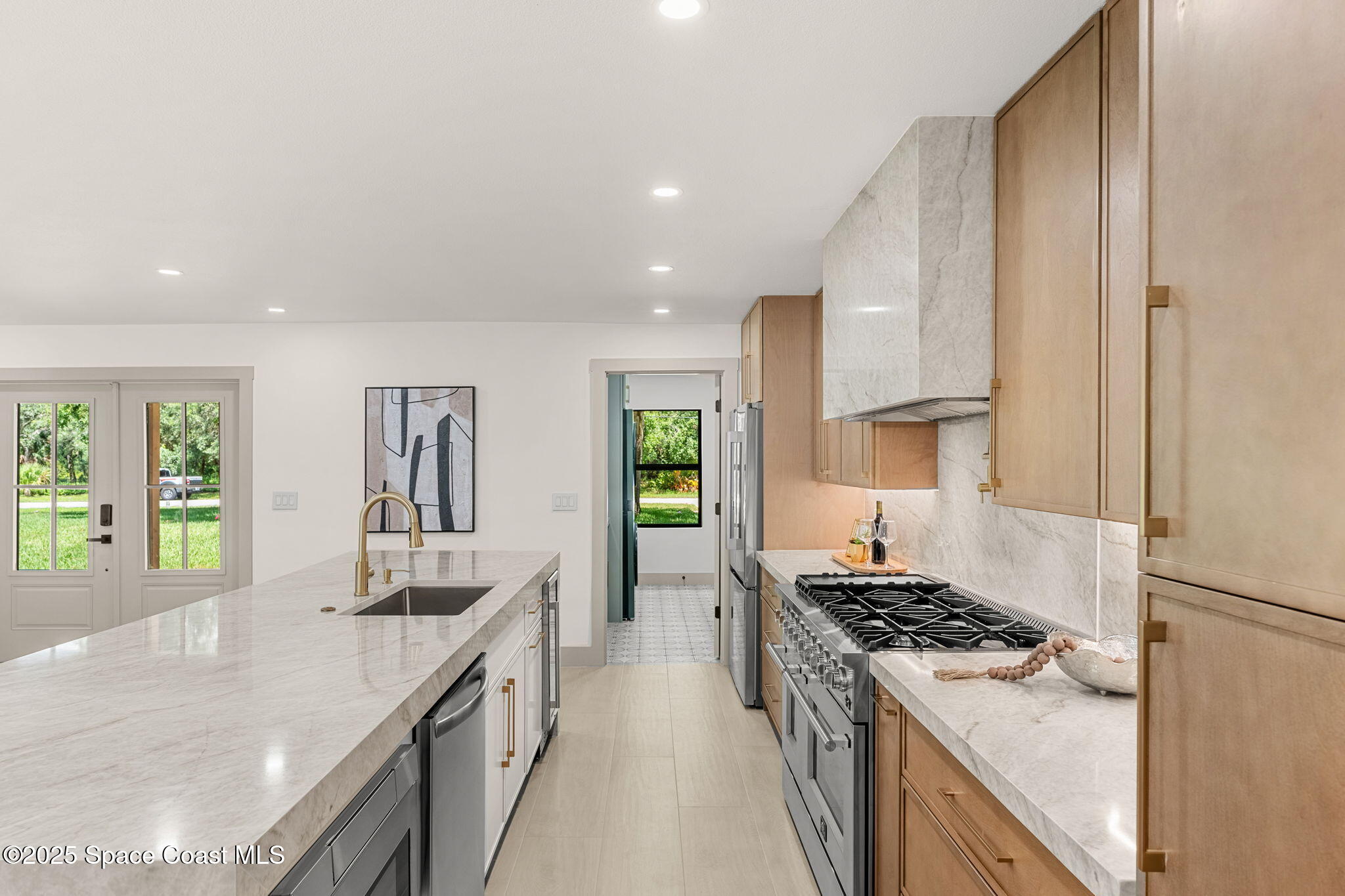 4313 Country Road Melbourne, FL 32934 - Photo 12 of 58 a kitchen with a stove and a sink