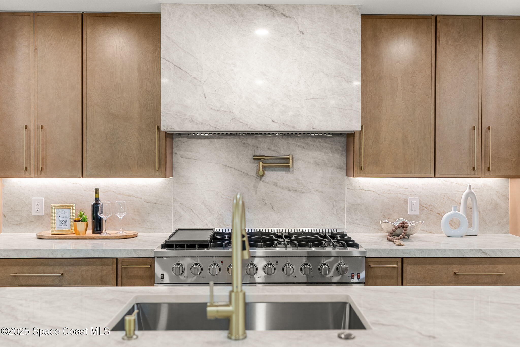 4313 Country Road Melbourne, FL 32934 - Photo 13 of 58 a kitchen with stainless steel appliances granite countertop a stove and a sink