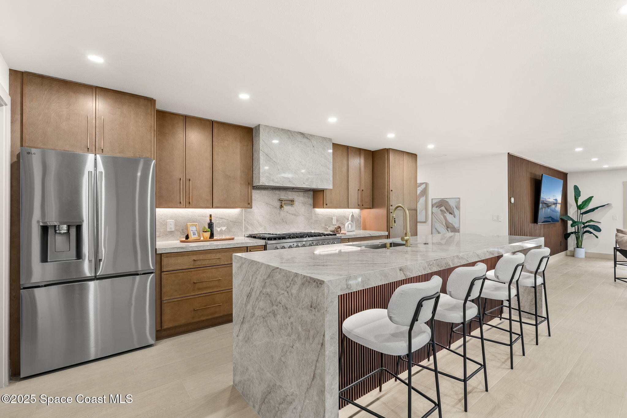 4313 Country Road Melbourne, FL 32934 - Photo 14 of 58 a kitchen with granite countertop a refrigerator a stove a sink a dining table and chairs