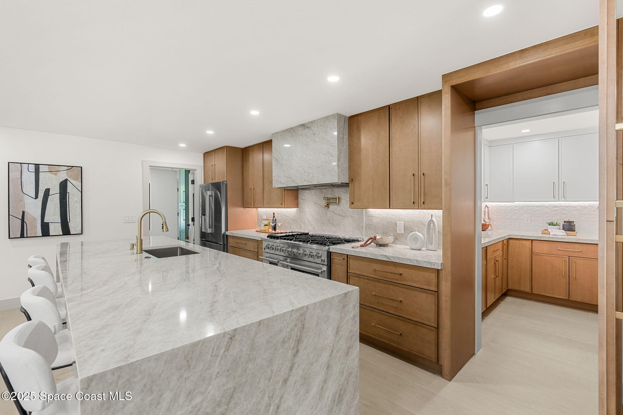 4313 Country Road Melbourne, FL 32934 - Photo 15 of 58 a kitchen with stainless steel appliances granite countertop a sink stove and cabinets