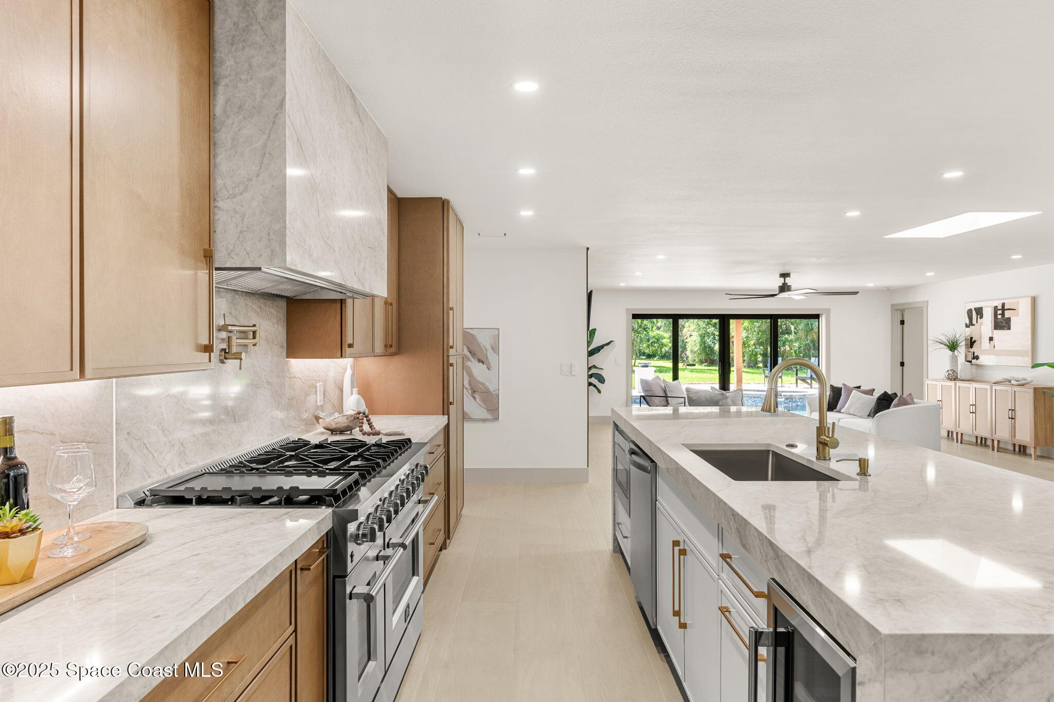 4313 Country Road Melbourne, FL 32934 - Photo 17 of 58 a kitchen with stainless steel appliances granite countertop a sink stove and cabinets