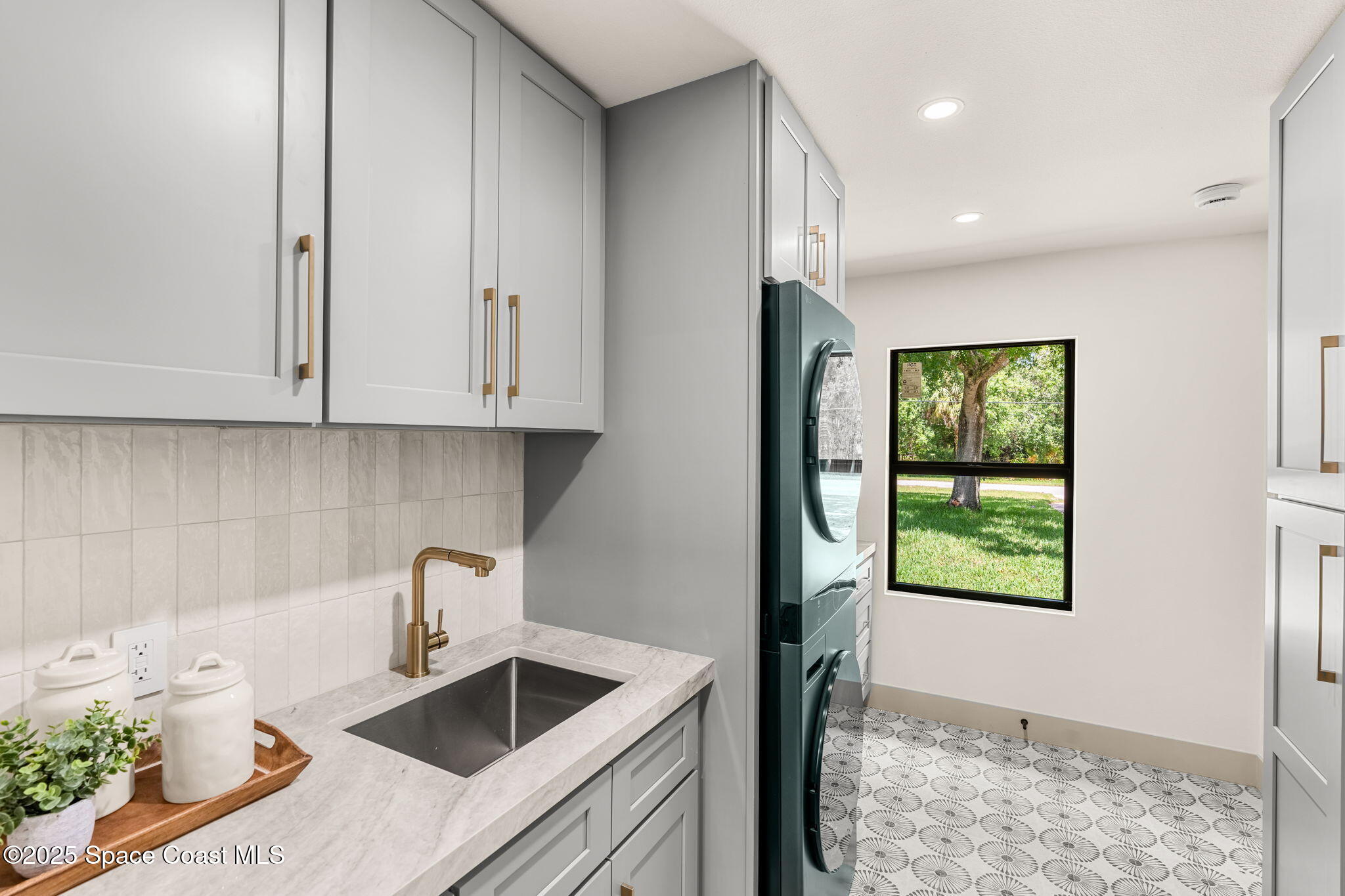 4313 Country Road Melbourne, FL 32934 - Photo 18 of 58 a kitchen that has a sink and a stove with wooden floor