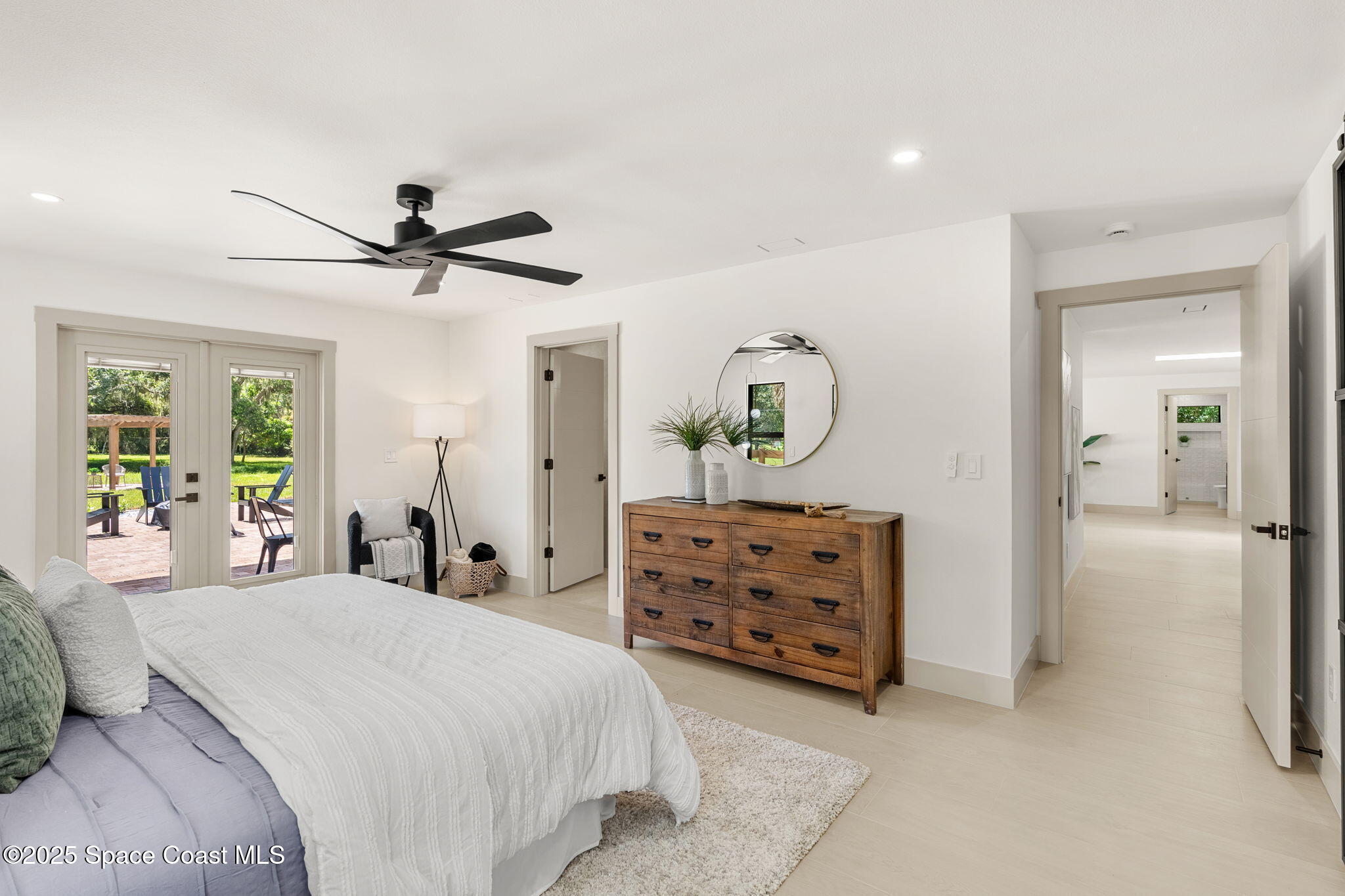 4313 Country Road Melbourne, FL 32934 - Photo 23 of 58 a bed room with a bed and a dresser