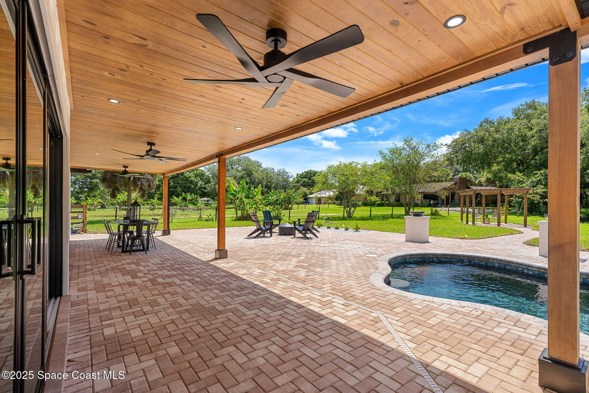 4313 Country Road Melbourne, FL 32934 - Photo 33 of 58 a view of a backyard with a big yard