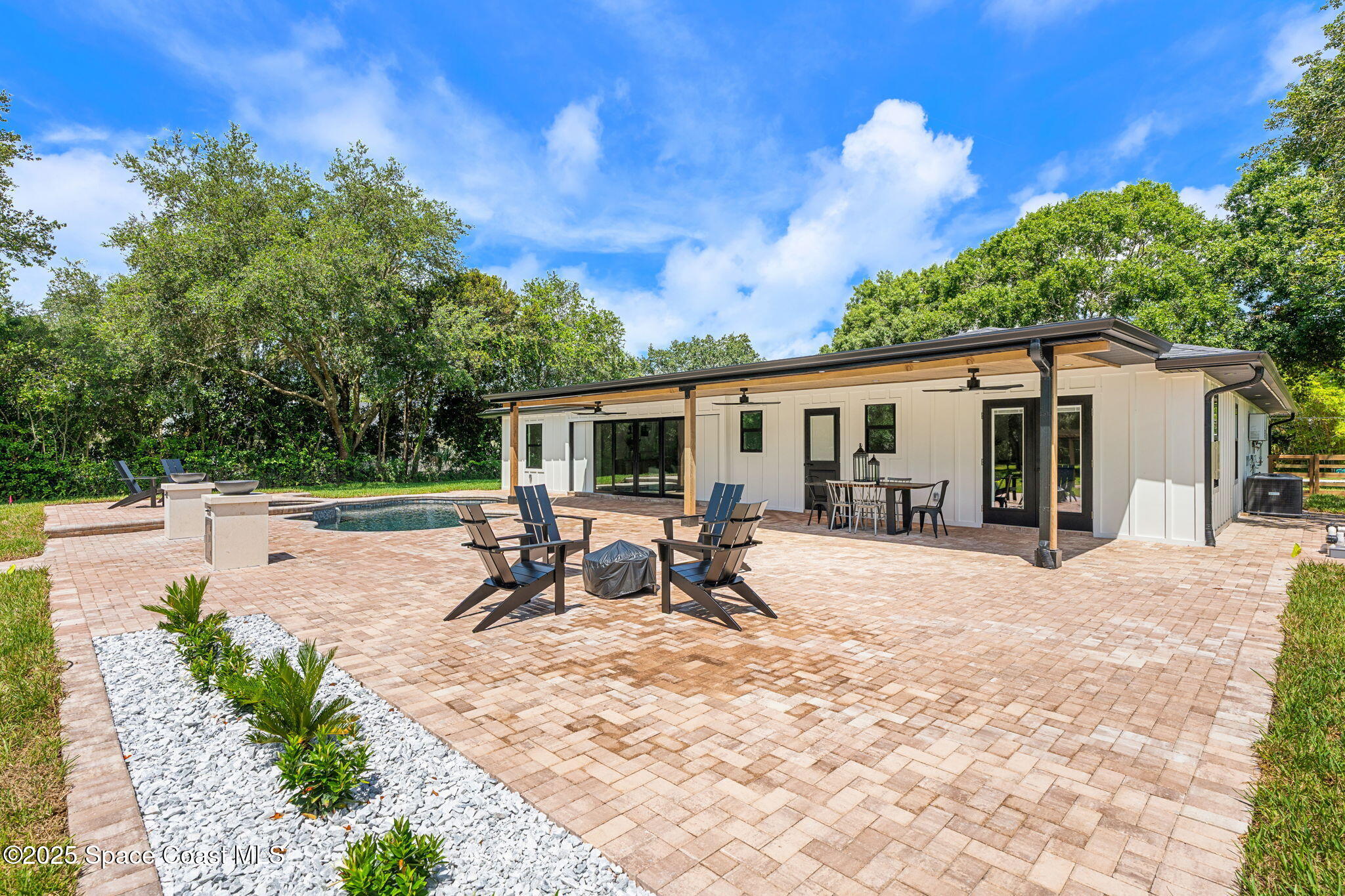4313 Country Road Melbourne, FL 32934 - Photo 38 of 58 a view of a backyard with sitting area