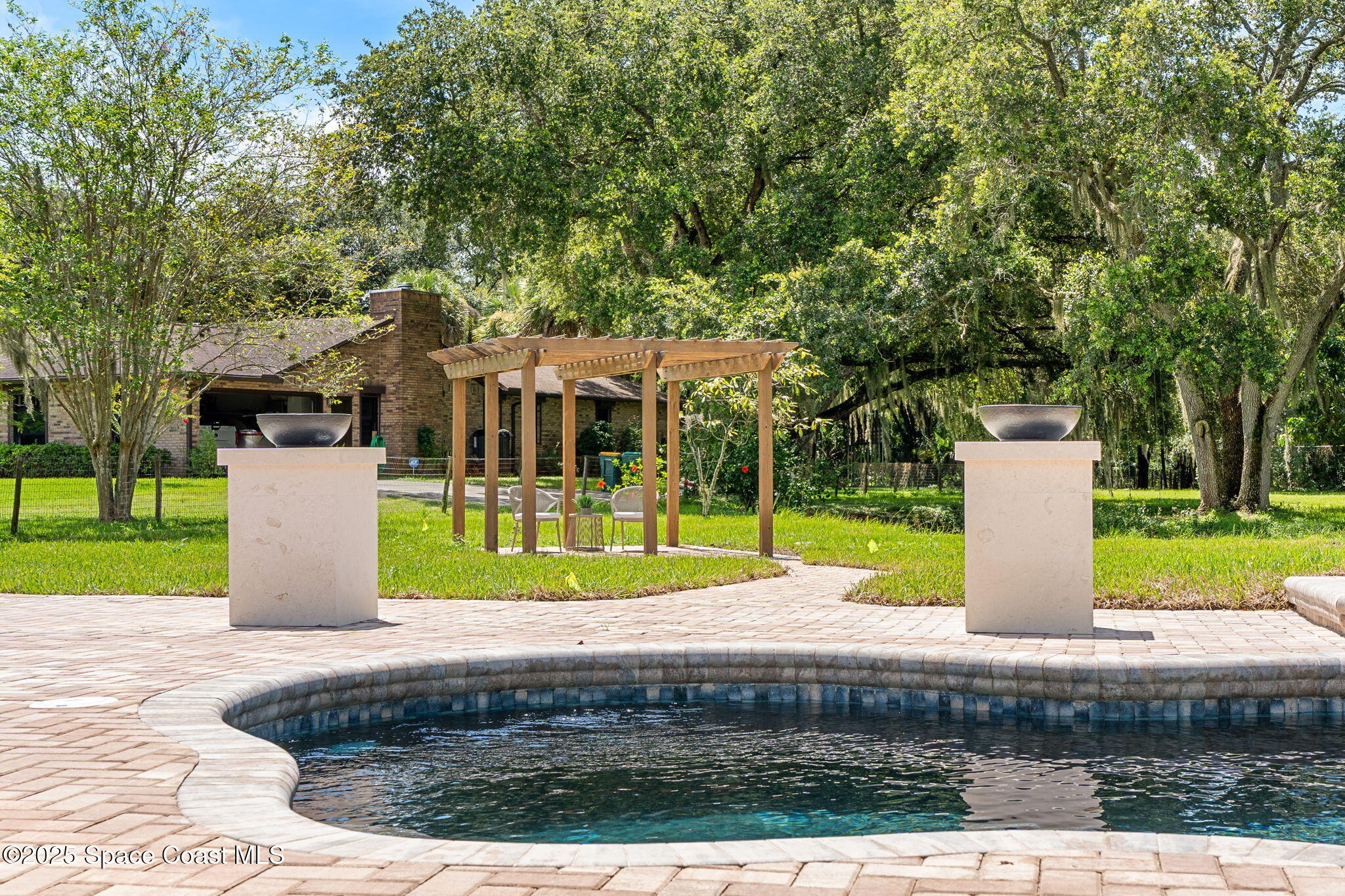 4313 Country Road Melbourne, FL 32934 - Photo 39 of 58 a view of a house with backyard and tree