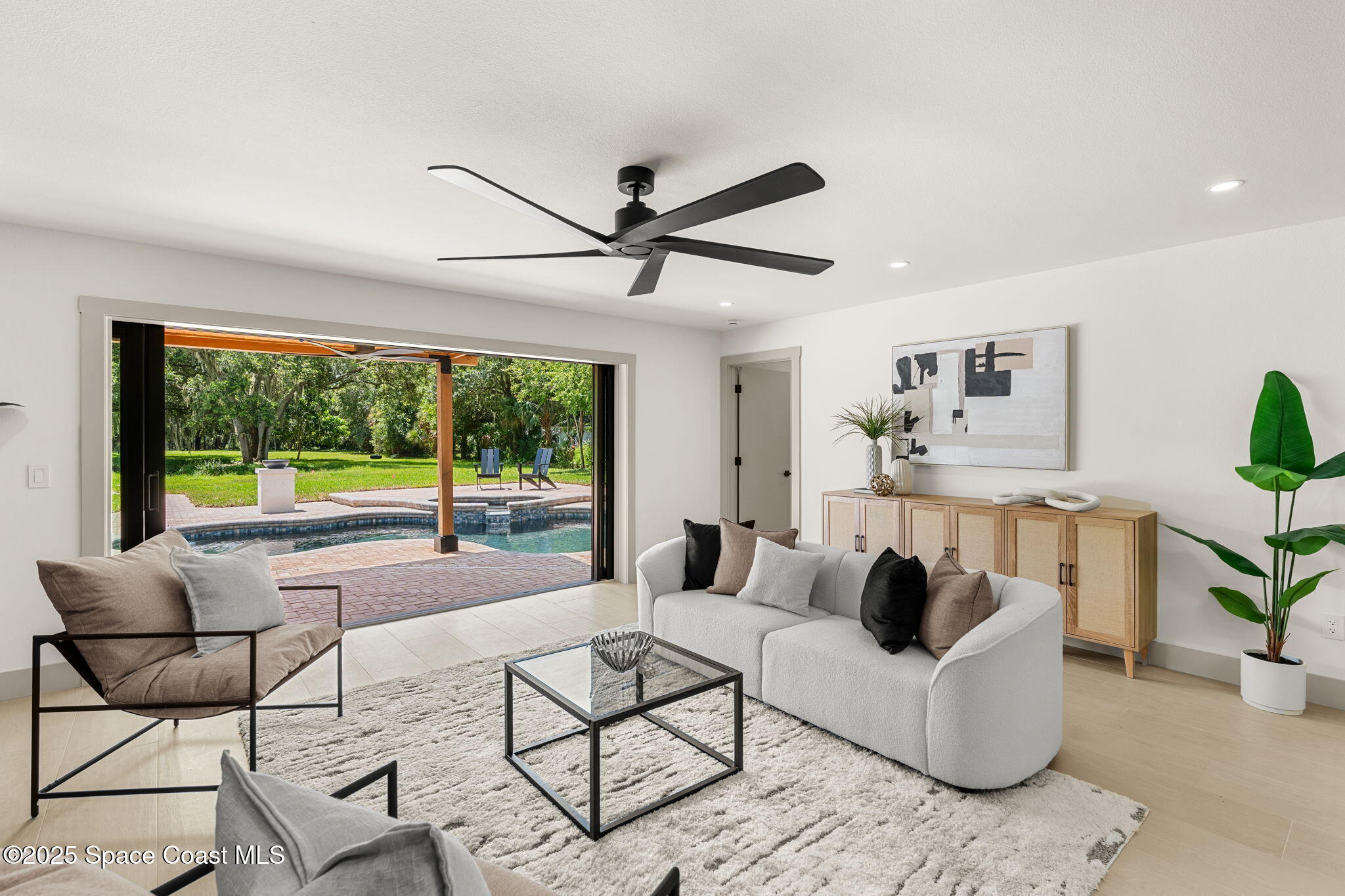 4313 Country Road Melbourne, FL 32934 - Photo 4 of 58 a living room with furniture and a large window