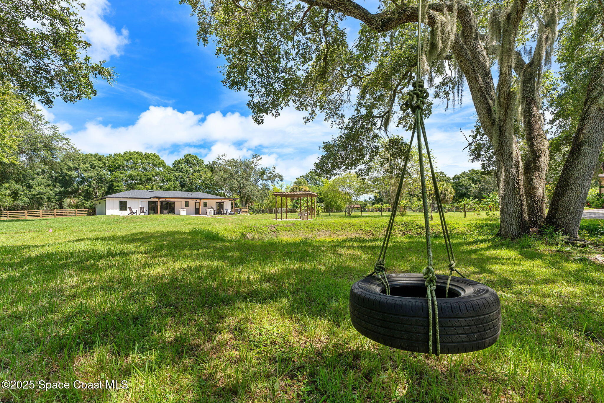 4313 Country Road Melbourne, FL 32934 - Photo 46 of 58 a view of a house with a yard