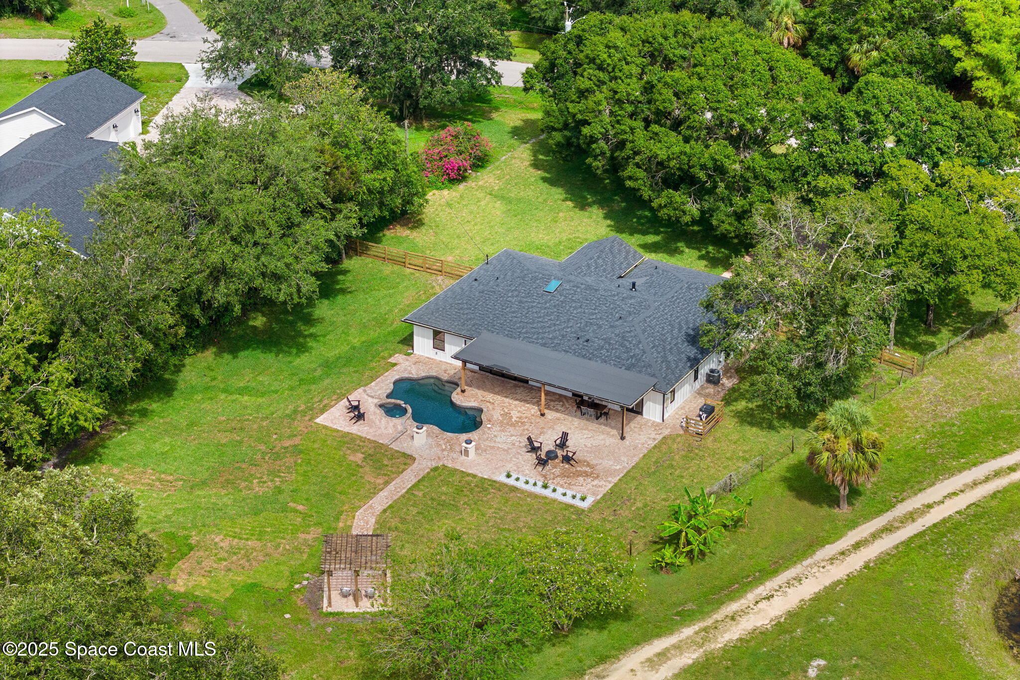 4313 Country Road Melbourne, FL 32934 - Photo 53 of 58 an aerial view of a house with a yard