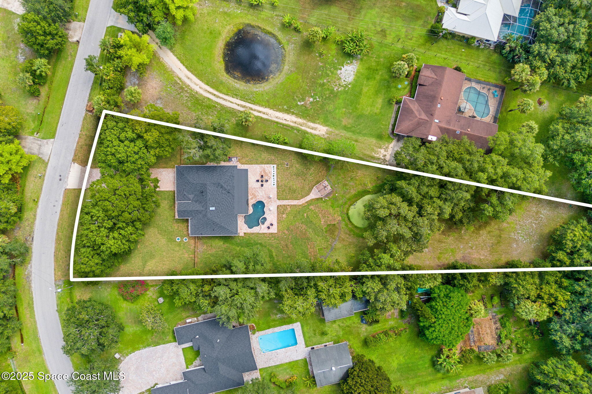 4313 Country Road Melbourne, FL 32934 - Photo 56 of 58 an aerial view of residential house with outdoor space and swimming pool