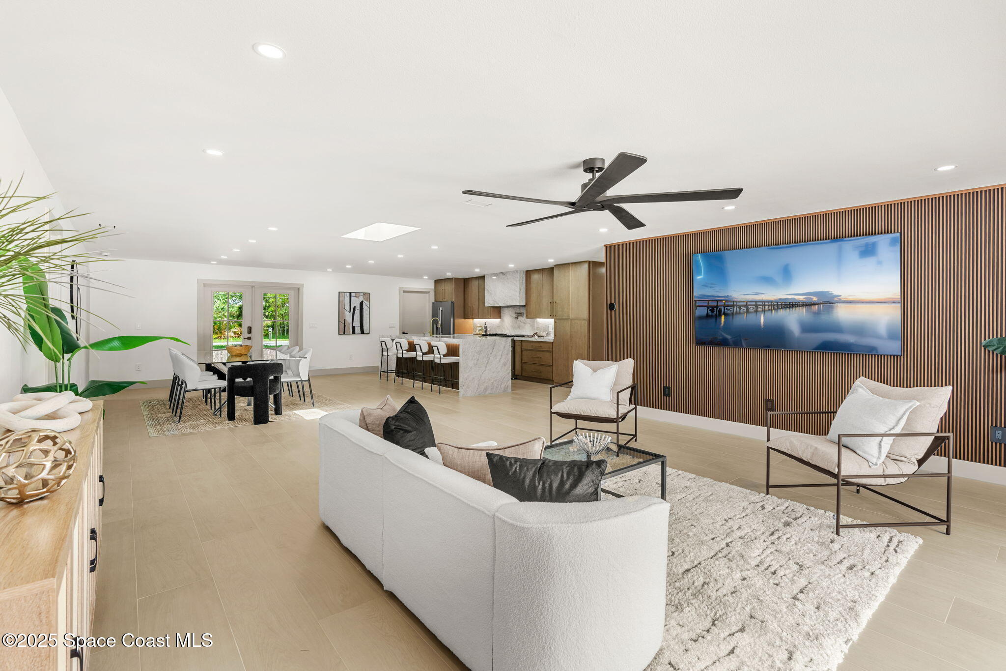 4313 Country Road Melbourne, FL 32934 - Photo 6 of 58 a living room with furniture and a large window