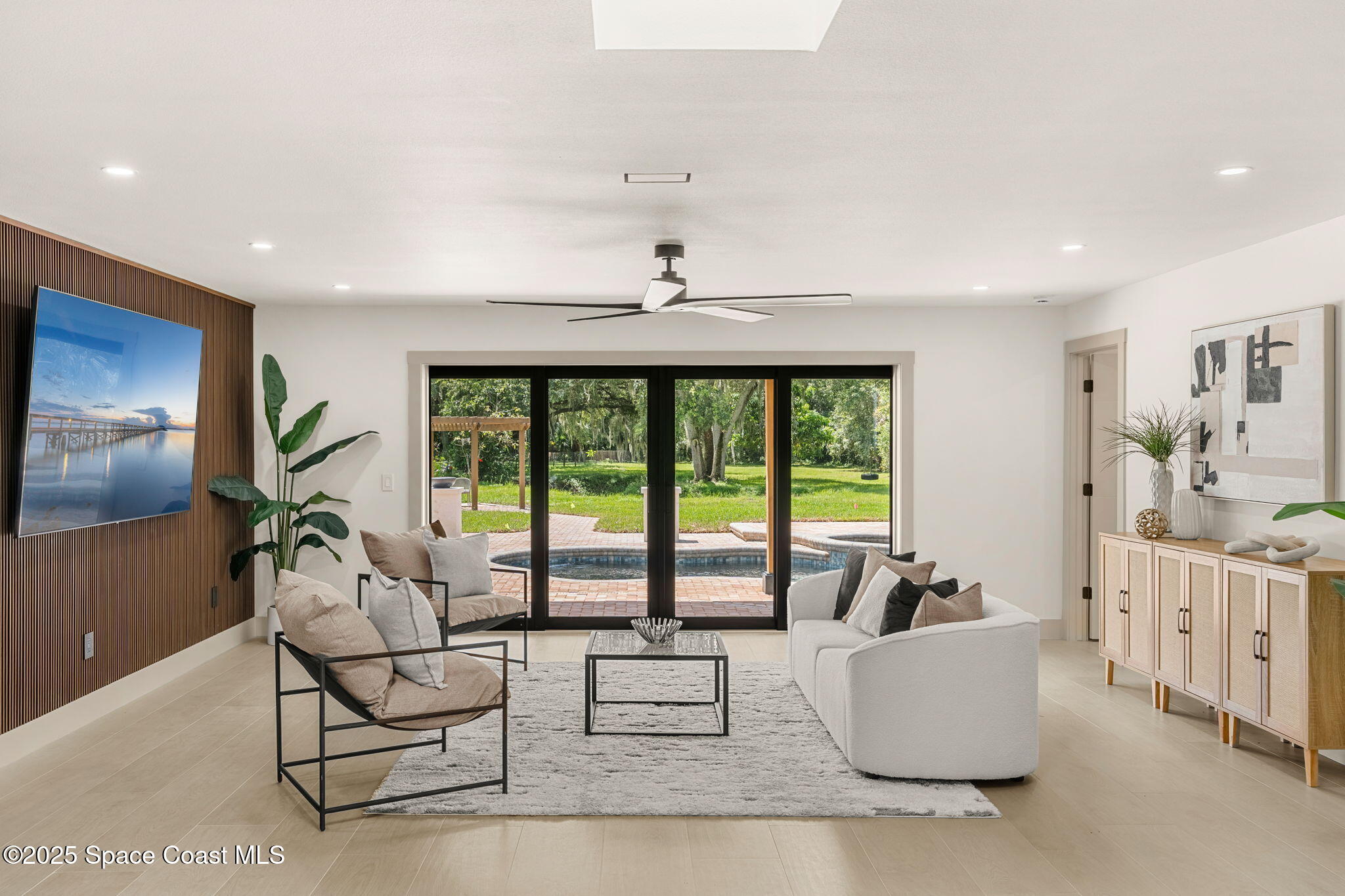 4313 Country Road Melbourne, FL 32934 - Photo 8 of 58 a living room with furniture and a large window