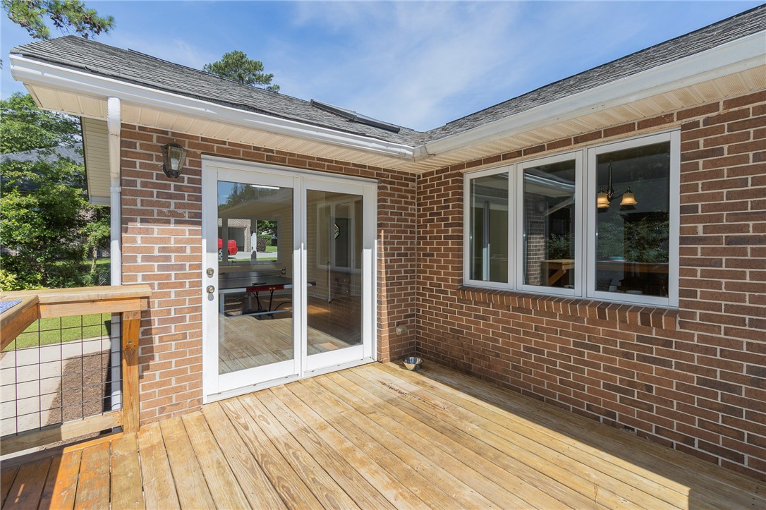 207 Laurel Ridge Road Anderson, SC 29621 - Photo 39 of 50 A durable brick exterior and a broad wooden deck provide ample outdoor entertaining space.